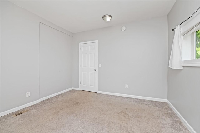 1084 Plymouth Ave S, Rochester, NY 14608 - spare room with carpet flooring and a smoke detector