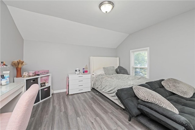 1084 Plymouth Ave S, Rochester, NY 14608 - bedroom with vaulted ceiling and wood finished floors