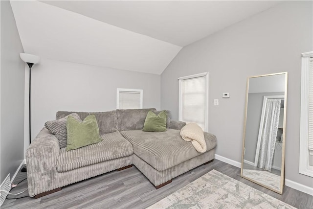 1084 Plymouth Ave S, Rochester, NY 14608 - living area with lofted ceiling and wood finished floors