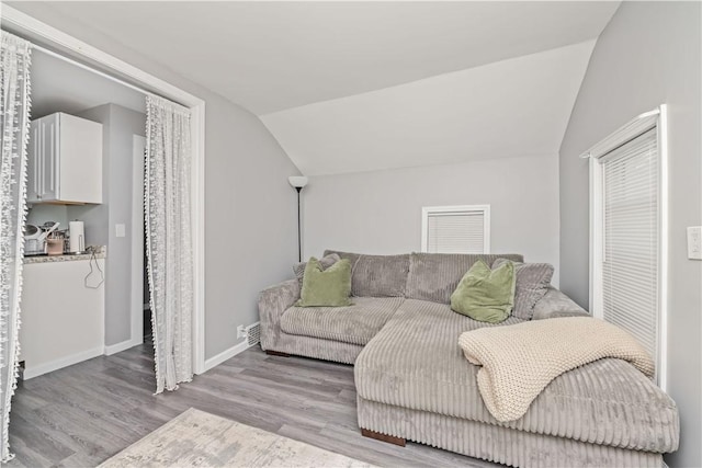1084 Plymouth Ave S, Rochester, NY 14608 - living area with vaulted ceiling and wood finished floors