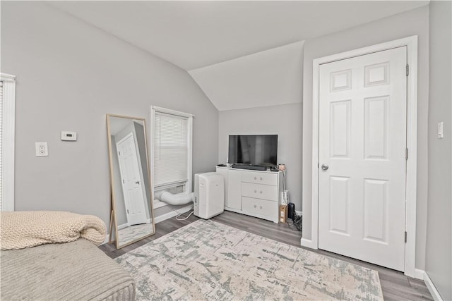 1084 Plymouth Ave S, Rochester, NY 14608 - bedroom featuring vaulted ceiling and wood finished floors