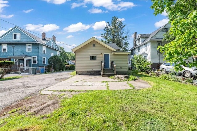 1084 Plymouth Ave S, Rochester, NY 14608 - rear view of house featuring asphalt driveway