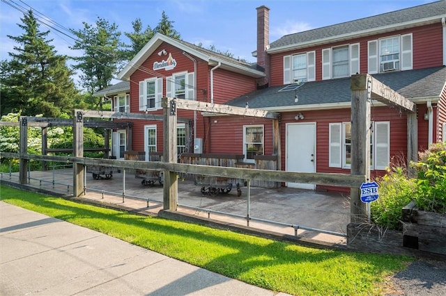 1369 Pittsford Mendon Rd, Mendon, NY 14506 - rear view of house featuring a chimney and a shingled roof