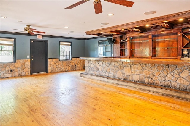 1369 Pittsford Mendon Rd, Mendon, NY 14506 - unfurnished living room with crown molding, ceiling fan, wood-type flooring, a wainscoted wall, and recessed lighting