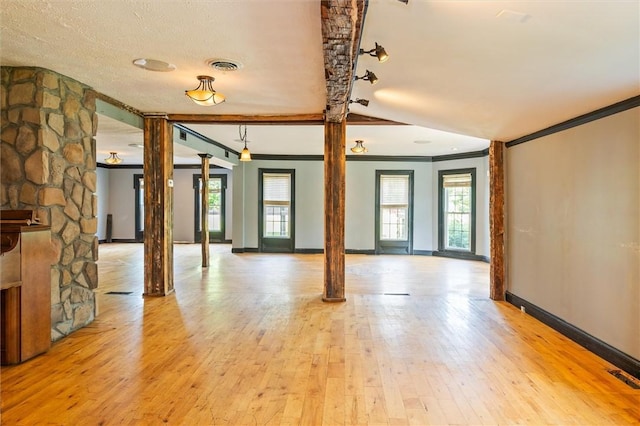 1369 Pittsford Mendon Rd, Mendon, NY 14506 - spare room featuring decorative columns, ornamental molding, and light wood-style floors