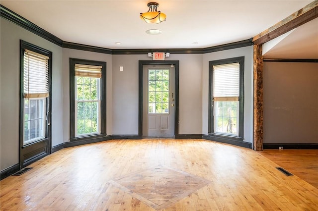 1369 Pittsford Mendon Rd, Mendon, NY 14506 - unfurnished room featuring ornamental molding, healthy amount of natural light, and wood finished floors