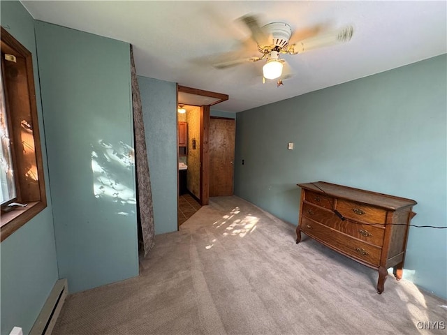 237 E Hamilton Ave, Sherrill, NY 13461 - unfurnished bedroom with a baseboard heating unit, carpet floors, and a ceiling fan