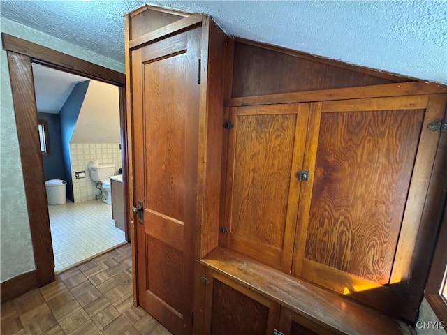237 E Hamilton Ave, Sherrill, NY 13461 - detailed view of a textured ceiling and tile walls