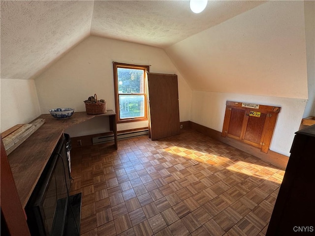237 E Hamilton Ave, Sherrill, NY 13461 - bonus room with a baseboard radiator, a textured ceiling, and vaulted ceiling