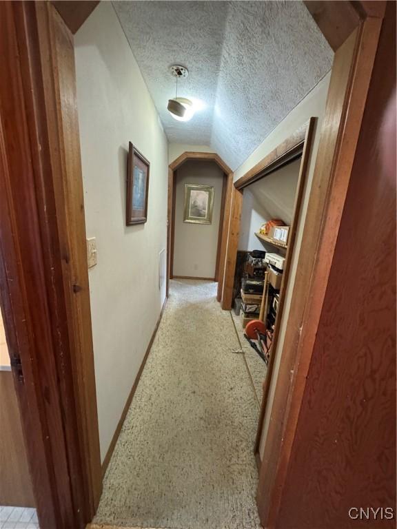 237 E Hamilton Ave, Sherrill, NY 13461 - hall with vaulted ceiling and a textured ceiling