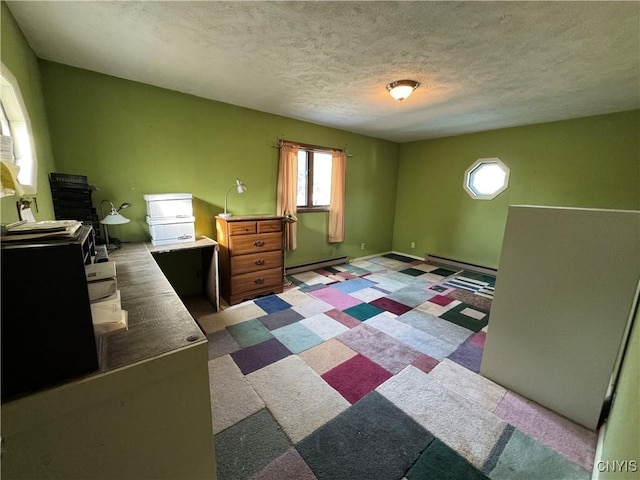 237 E Hamilton Ave, Sherrill, NY 13461 - bedroom with a baseboard radiator, a textured ceiling, and light floors
