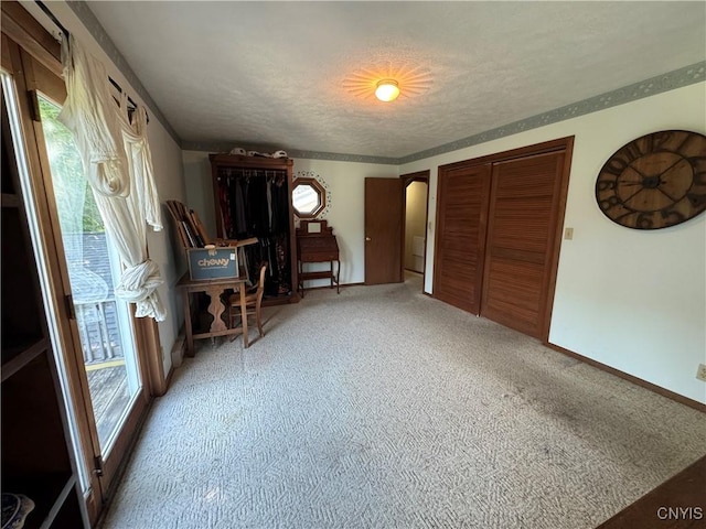 237 E Hamilton Ave, Sherrill, NY 13461 - unfurnished bedroom featuring arched walkways, carpet flooring, a textured ceiling, and a closet
