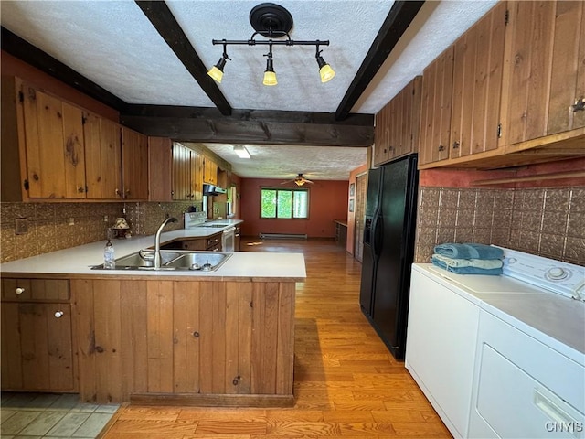 237 E Hamilton Ave, Sherrill, NY 13461 - kitchen with a ceiling fan, light wood-style flooring, washer and dryer, beam ceiling, and a textured ceiling