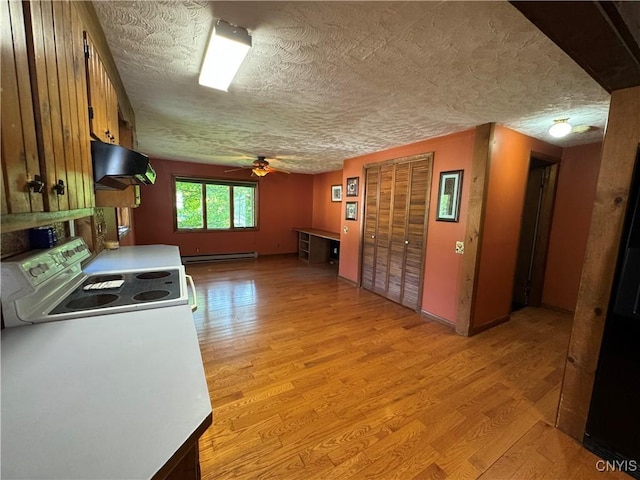 237 E Hamilton Ave, Sherrill, NY 13461 - kitchen featuring range hood, light wood-style floors, a textured ceiling, a baseboard heating unit, and a ceiling fan