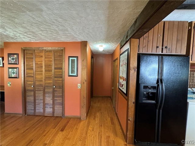 237 E Hamilton Ave, Sherrill, NY 13461 - hall with light wood-style floors and a textured ceiling