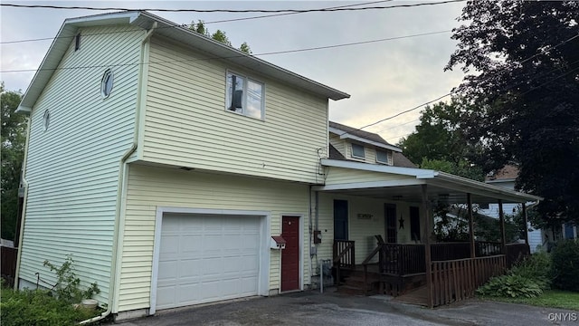 237 E Hamilton Ave, Sherrill, NY 13461 - view of front facade with a porch, a garage, and driveway