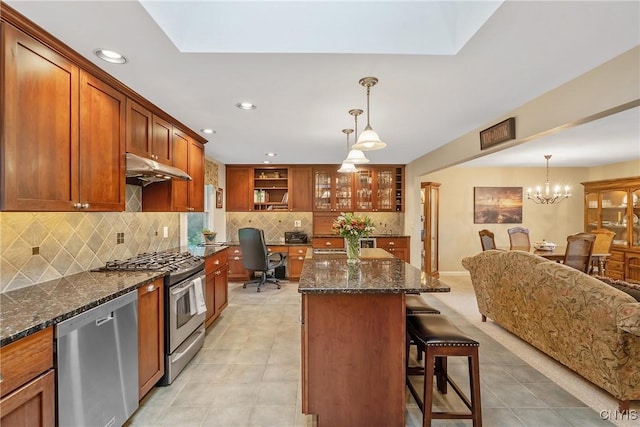 1705 Lancelot Pl, Skaneateles, NY 13152 - kitchen with appliances with stainless steel finishes, recessed lighting, a kitchen island, a kitchen bar, and brown cabinets