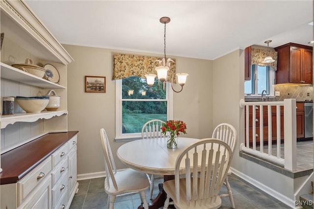1705 Lancelot Pl, Skaneateles, NY 13152 - dining space featuring a chandelier and dark tile patterned floors