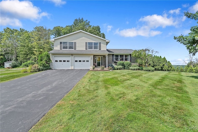 1705 Lancelot Pl, Skaneateles, NY 13152 - view of front of home featuring driveway, a garage, and a front yard