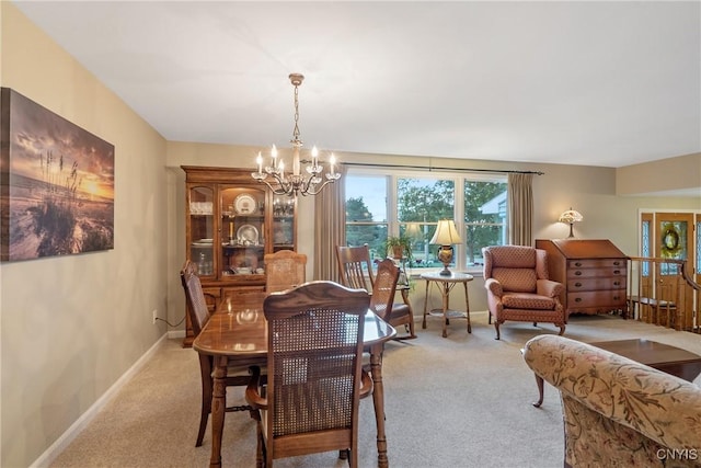 1705 Lancelot Pl, Skaneateles, NY 13152 - dining area with light carpet and a chandelier