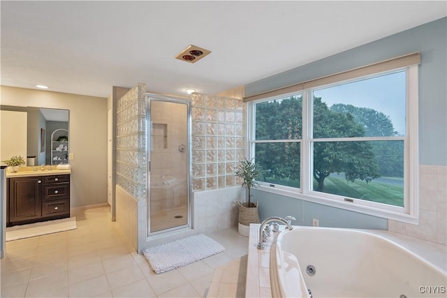 1705 Lancelot Pl, Skaneateles, NY 13152 - bathroom featuring a whirlpool tub, vanity, a stall shower, and tile patterned flooring