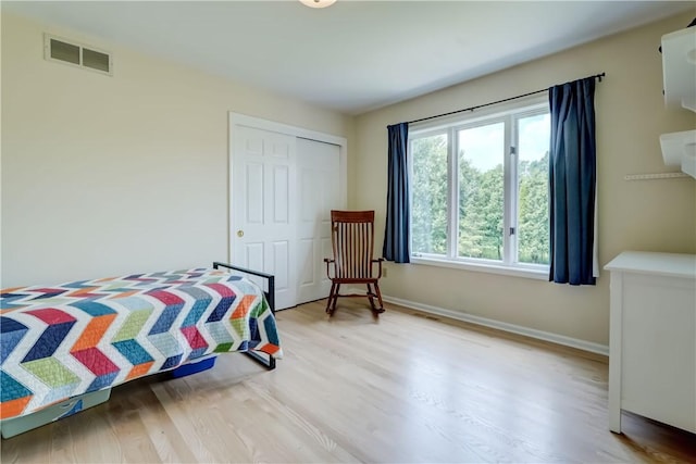 10 Muirfield Ct, Pittsford, NY 14534 - bedroom with wood finished floors and a closet