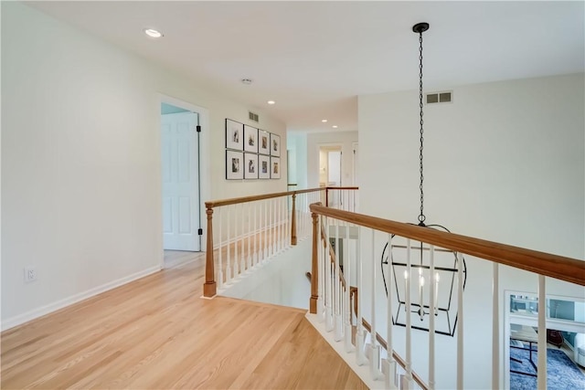 10 Muirfield Ct, Pittsford, NY 14534 - corridor featuring an upstairs landing, wood finished floors, and recessed lighting