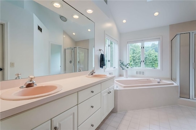 10 Muirfield Ct, Pittsford, NY 14534 - bathroom featuring a stall shower, double vanity, a bath, recessed lighting, and vaulted ceiling