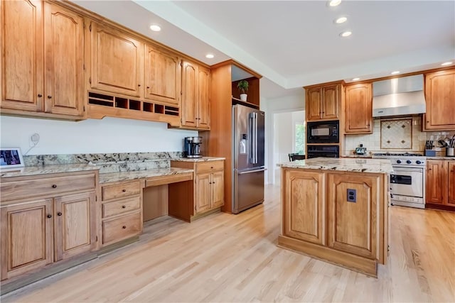 10 Muirfield Ct, Pittsford, NY 14534 - kitchen featuring premium appliances, wall chimney range hood, open shelves, built in study area, and light wood-style flooring