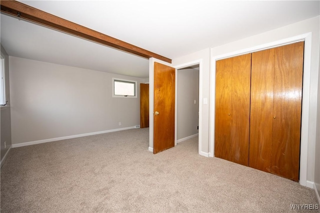 92 Schiller St, Buffalo, NY 14206 - unfurnished bedroom featuring carpet, a closet, and beamed ceiling