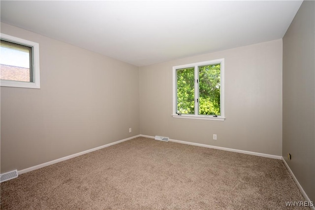 92 Schiller St, Buffalo, NY 14206 - carpeted empty room with healthy amount of natural light