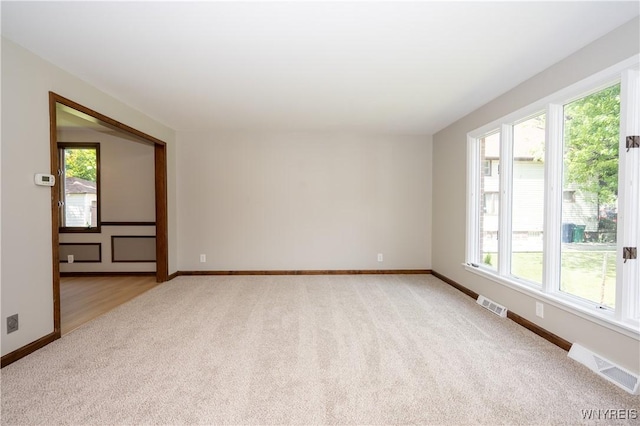 92 Schiller St, Buffalo, NY 14206 - spare room with light colored carpet and healthy amount of natural light