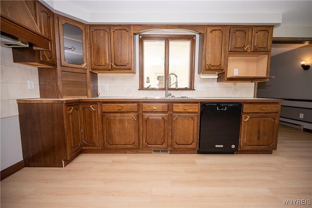 92 Schiller St, Buffalo, NY 14206 - kitchen with dishwasher, light wood-style flooring, and brown cabinets