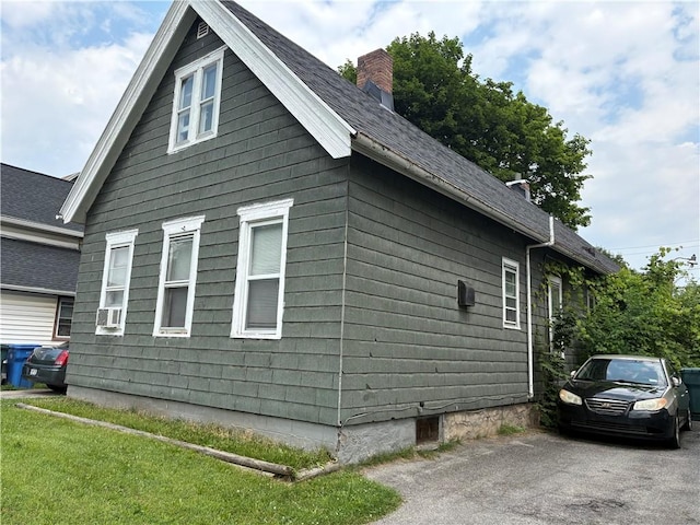 74 Ave D Ave, Rochester, NY 14621 - view of home's exterior featuring a chimney