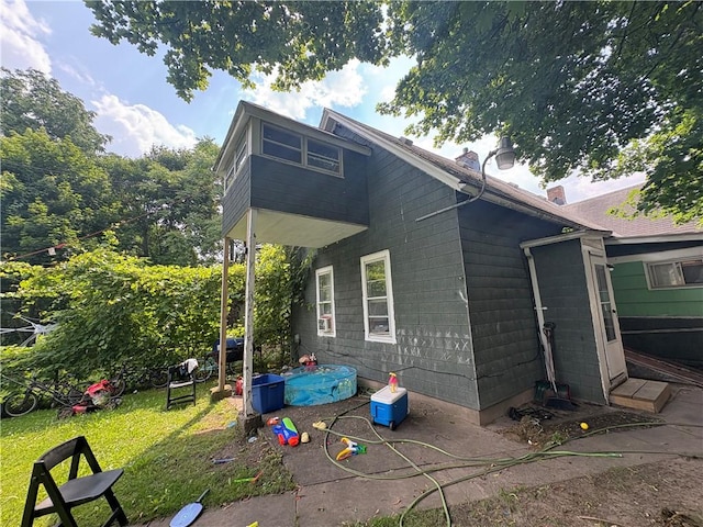 74 Ave D Ave, Rochester, NY 14621 - view of home's exterior featuring concrete block siding