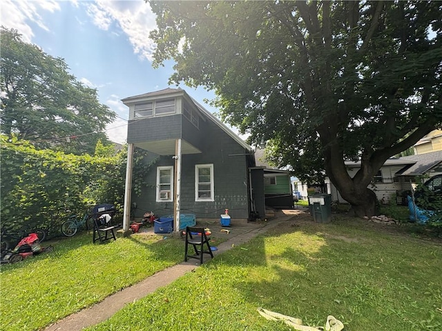 74 Ave D Ave, Rochester, NY 14621 - rear view of house with a yard