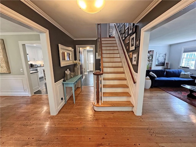 290 Hollywood Ave, Brighton, NY 14618 - staircase with hardwood / wood-style floors, wainscoting, and ornamental molding