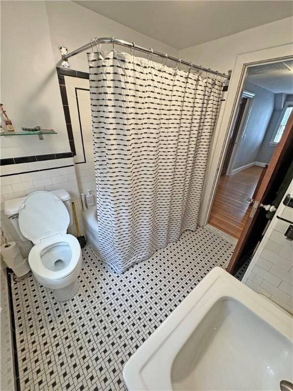 290 Hollywood Ave, Brighton, NY 14618 - bathroom featuring tile walls, wainscoting, and tile patterned flooring