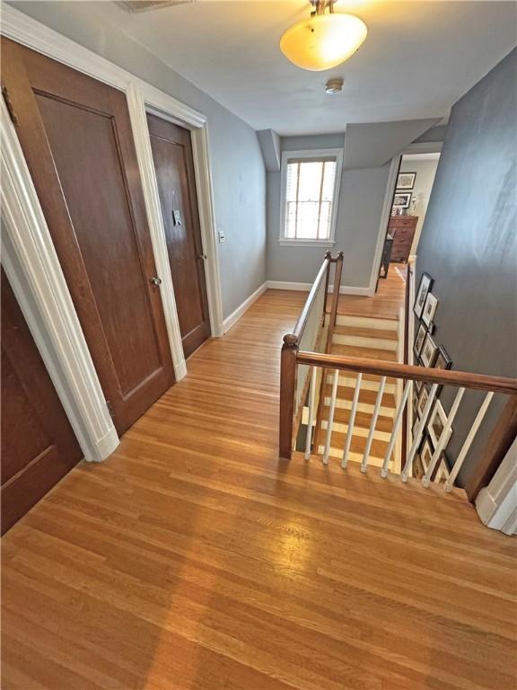 290 Hollywood Ave, Brighton, NY 14618 - hall featuring an upstairs landing and light wood-style floors
