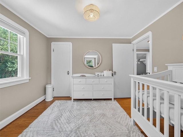 245 Worthington Rd, Irondequoit, NY 14622 - bedroom featuring ornamental molding and wood finished floors