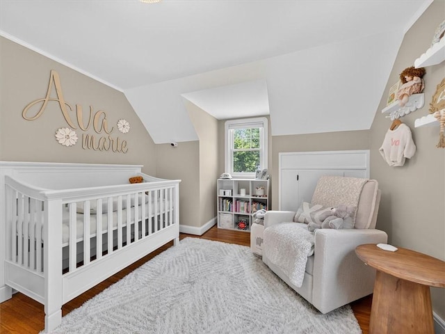 245 Worthington Rd, Irondequoit, NY 14622 - bedroom with wood finished floors, lofted ceiling, and a nursery area