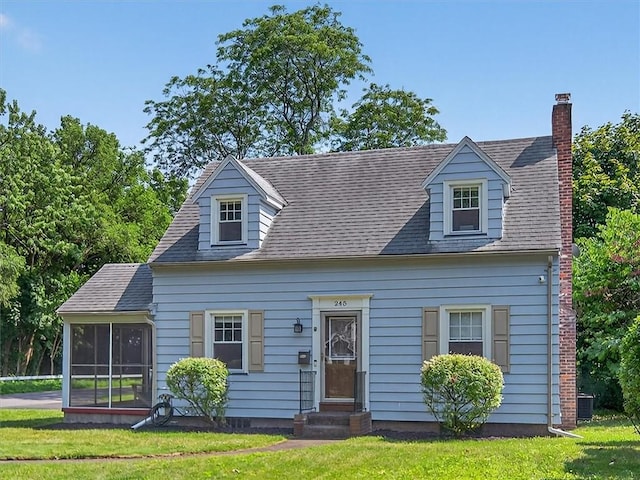245 Worthington Rd, Irondequoit, NY 14622 - cape cod-style house with a sunroom, entry steps, and a front yard