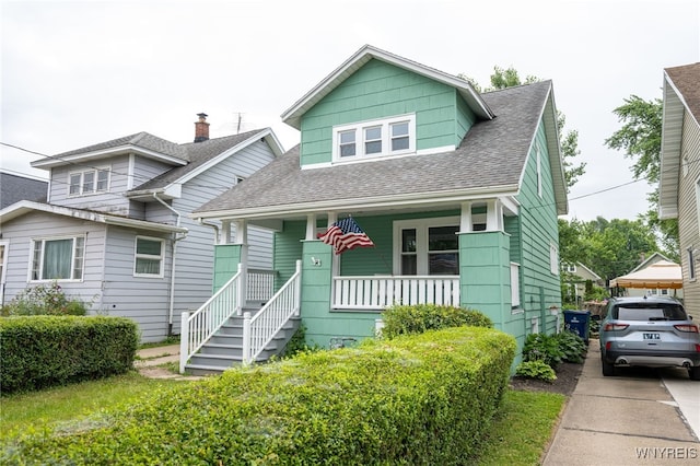 827 Tifft St, Buffalo, NY 14220 - bungalow featuring covered porch and roof with shingles
