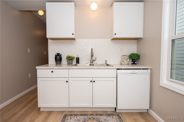 827 Tifft St, Buffalo, NY 14220 - kitchen featuring dishwasher, light wood-type flooring, decorative backsplash, light countertops, and white cabinetry