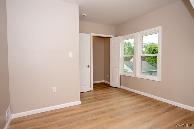 827 Tifft St, Buffalo, NY 14220 - unfurnished bedroom featuring light wood-style floors
