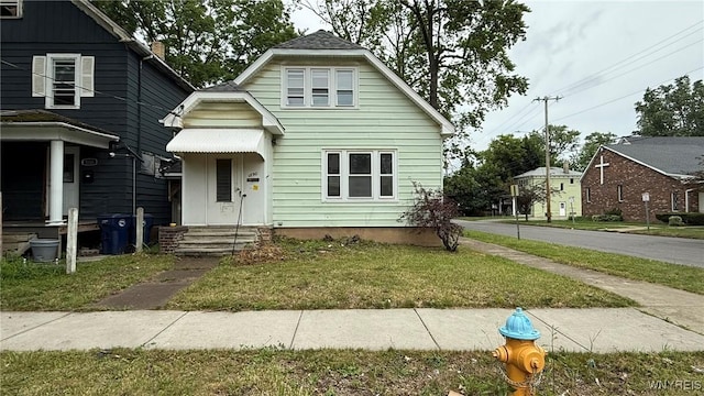 1890 Linwood Ave, Niagara Falls, NY 14305 - bungalow-style home featuring a front yard and entry steps
