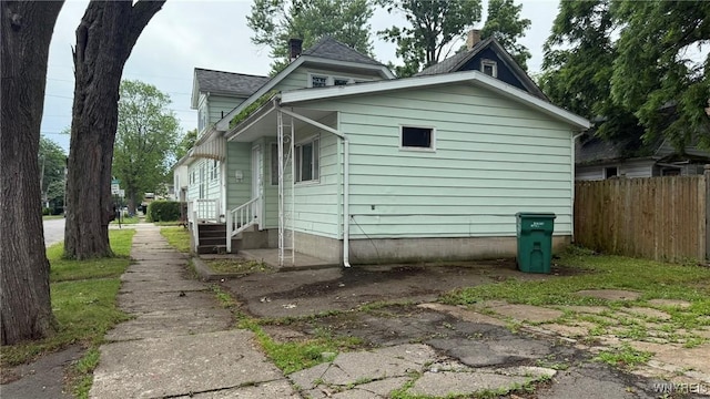 1890 Linwood Ave, Niagara Falls, NY 14305 - view of property exterior with a chimney