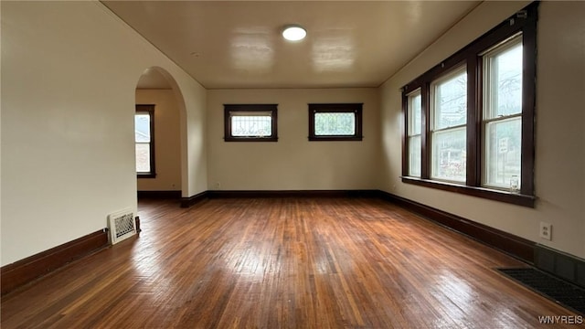 1890 Linwood Ave, Niagara Falls, NY 14305 - spare room featuring wood-type flooring and arched walkways