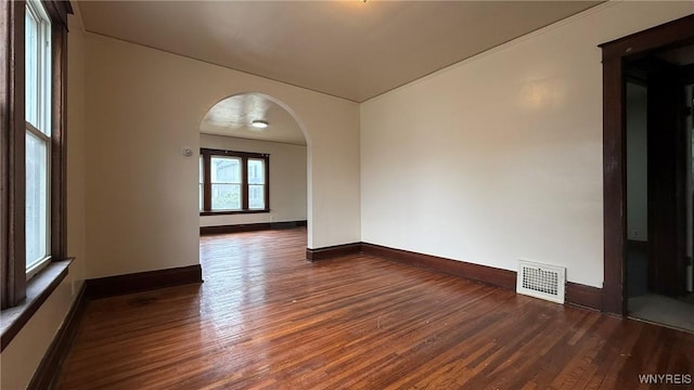 1890 Linwood Ave, Niagara Falls, NY 14305 - unfurnished room featuring arched walkways and wood finished floors