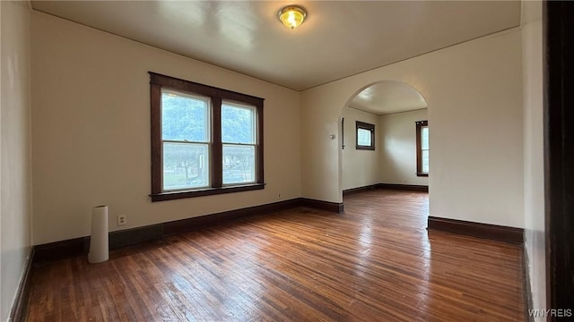 1890 Linwood Ave, Niagara Falls, NY 14305 - spare room featuring arched walkways and wood-type flooring